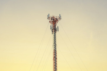 Telecommunication tower Antenna at sunset.