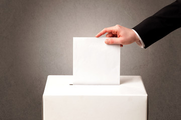 Ballot box with person casting vote