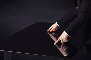 Close up of a hand touching smart table with copy space