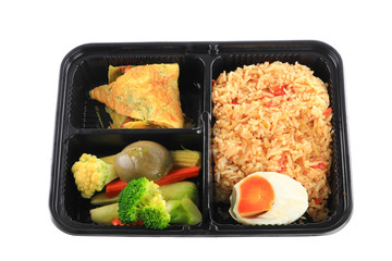 close up fried rice with egg and vegetables in lunch box set  on white background
