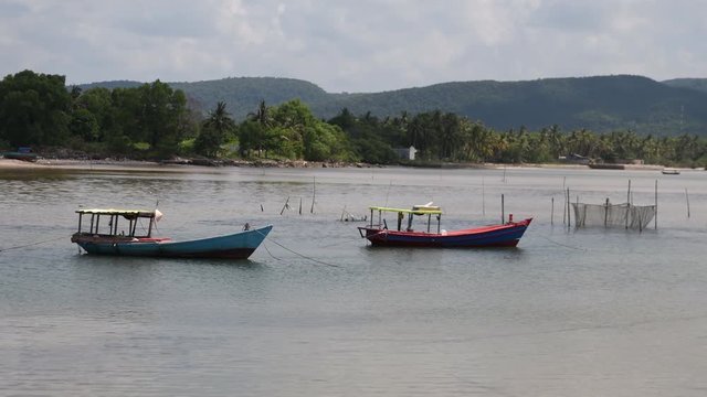 Two boats in the shallow water in Phu Quoc, VIetnum