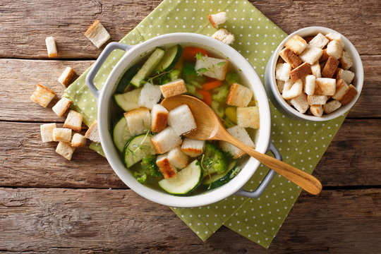 Vegetarian vegetable soup with croutons and thyme close-up in a bowl. horizontal top view