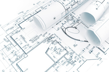 architectural background with rolls of technical drawings and blueprints