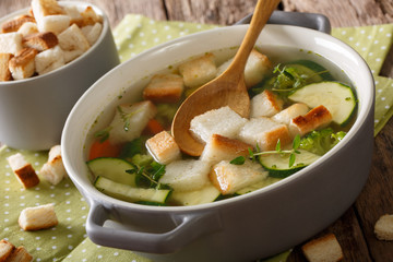 Vegetarian vegetable soup with croutons and thyme close-up in a bowl. horizontal