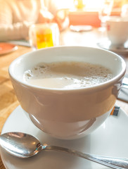 White Coffee cup on table in cafe .