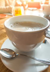 White Coffee cup on table in cafe .