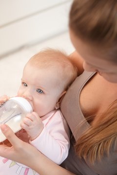 Baby with nursing bottle