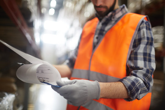 Supervisor reading document at work