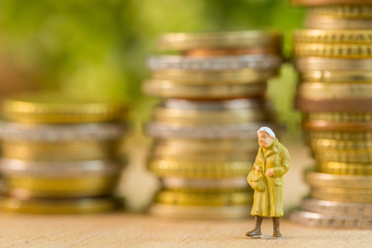 Retire elderly women walking alone concept with coin stack