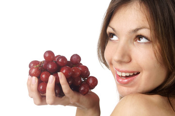 studio portrait of young beautiful woman with grape isolated on white background