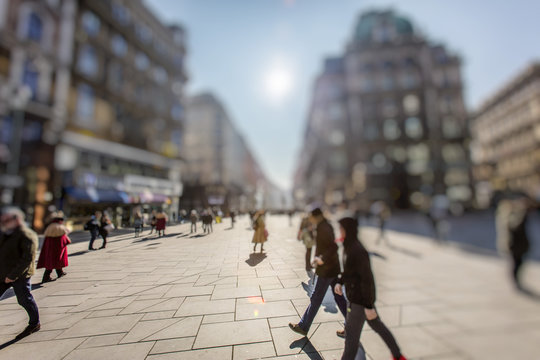 Silhouette Of People Walking On City Streets  