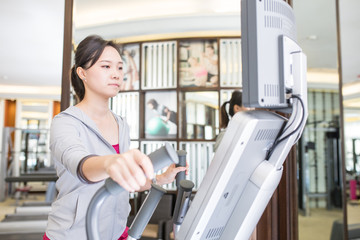  Asian woman running with machine walking