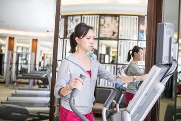 Fototapeta na wymiar Asian woman running with machine walking