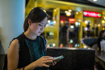 Asian woman play smartphone