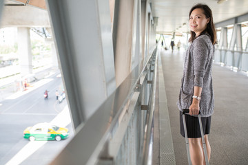 Asian woman traveller walking