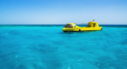 Egyptian submarine with a glass bottom organize sightseeing tourist tours. Travel and vacation in Egypt concept.