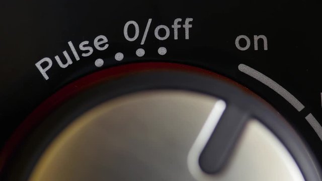 Footage of a person starting a blender and uses the pulse function...