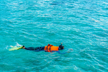 Snorkeling in tropical Maldives island .