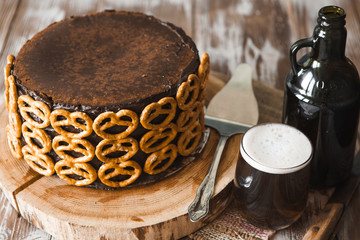 Сhocolate cake with ale decorated with salted pretzel