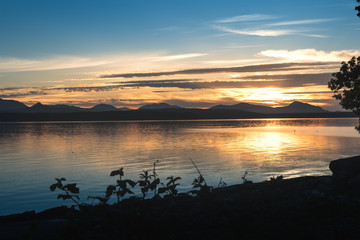 Sunset ocean mountains