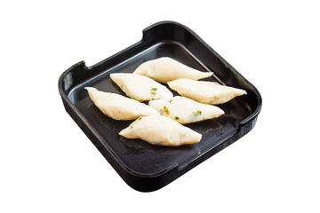 Fish ball in black plate isolated on white background with clipping path.