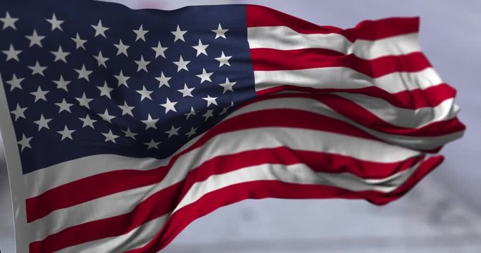 Flag of USA blowing on the wind, close up looped slowmotion, 4K