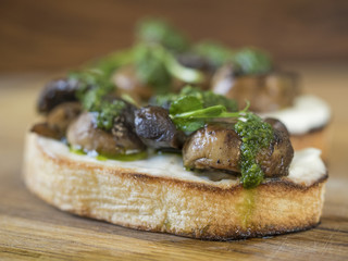 Bruschetta with baked champignons