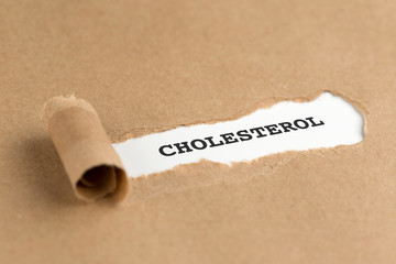 The text CHOLESTEROL appearing behind torn brown paper