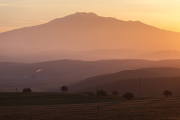 Fototapeta na wymiar Sunrise over mount Etna - tallest active volcano in Europe. Sicily, Italy
