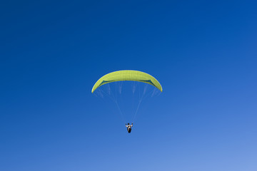 Paragliding in blue sky