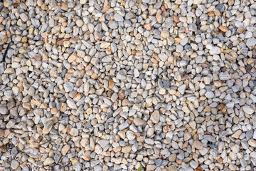 Background and texture of river stones pebbles surface.