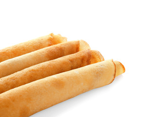 Tasty rolled pancakes, isolated on white