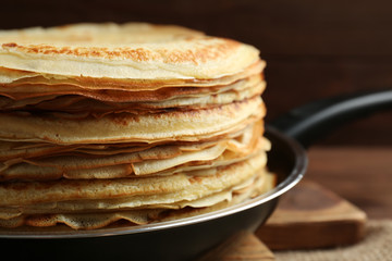 Tasty pancakes on pan, closeup