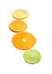 Slices of citrus fruits on white background