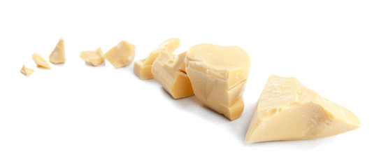 Pieces of cocoa butter on white background