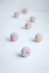 Frozen Plums as Ingredient for Smoothie or Cake Desert Fresh Fruit Isolated