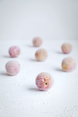 Frozen Plums as Ingredient for Smoothie or Cake Desert Fresh Fruit Isolated