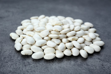 Pile of butter beans on grey background
