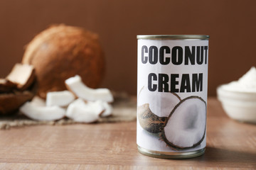 Coconut cream in tin on wooden table