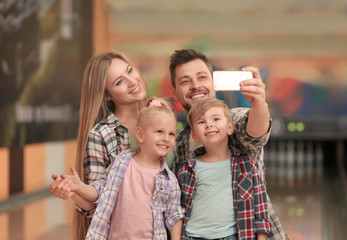 Family taking selfie at bowling club