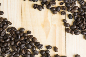 coffee beans on wooden background with effect filter.