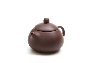 purple clay teapot isolated on white background