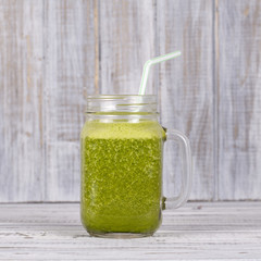 Smoothies from dill, celery and banana, close up