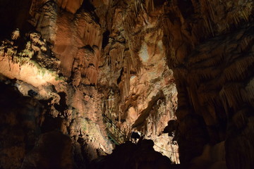 Inside view of an underground cave with stalagmites and stalactites