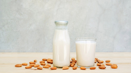 Almond milk on a wooden table.