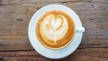 Hot coffee on a wooden table.