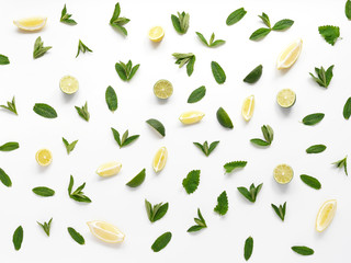 Pattern of mint, lemon and lime. Food background with citrus. Mint leaves, lemon slices and lime isolated on white background.