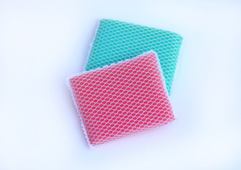 multi-colorful kitchen sponges for ware washing on white background.