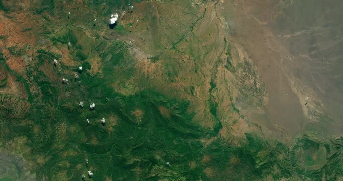 High-altitude overflight aerial of Lake Natron and surrounding land, northern Tanzania. Clip loops and is reversible. Elements of this image furnished by USGS/NASA Landsat