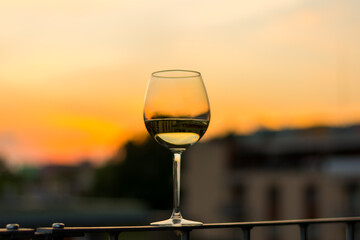 Wine in glasses with sunset background